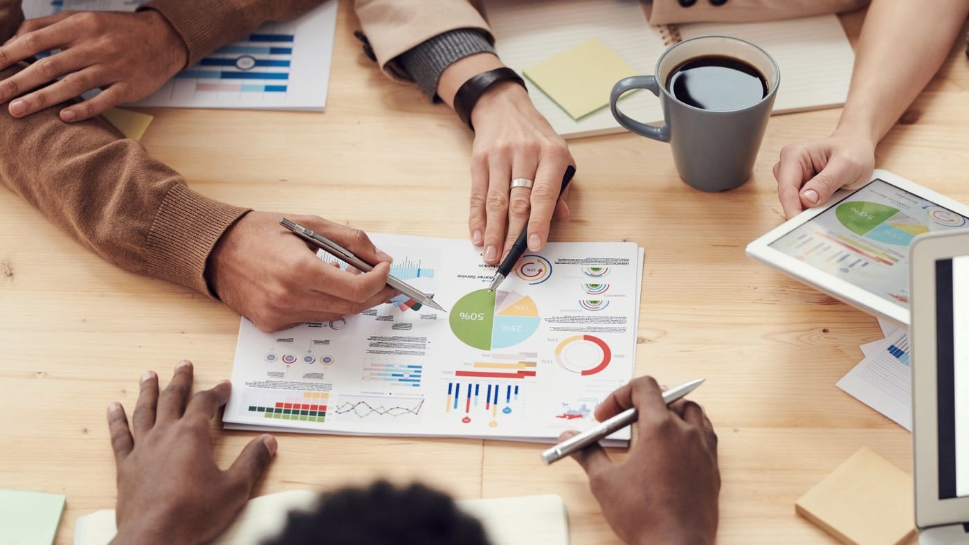 Weighing charts and tradeoffs around a work table